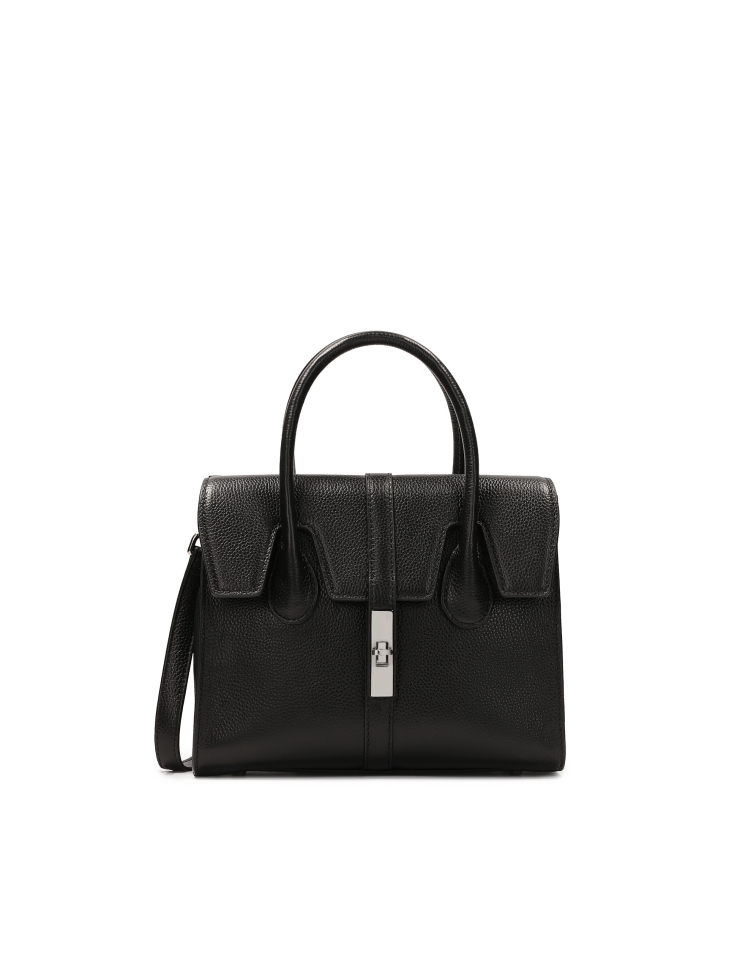 Black handbag in the shape of a trunk