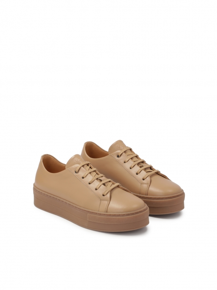 Light brown sneakers on a thick sole