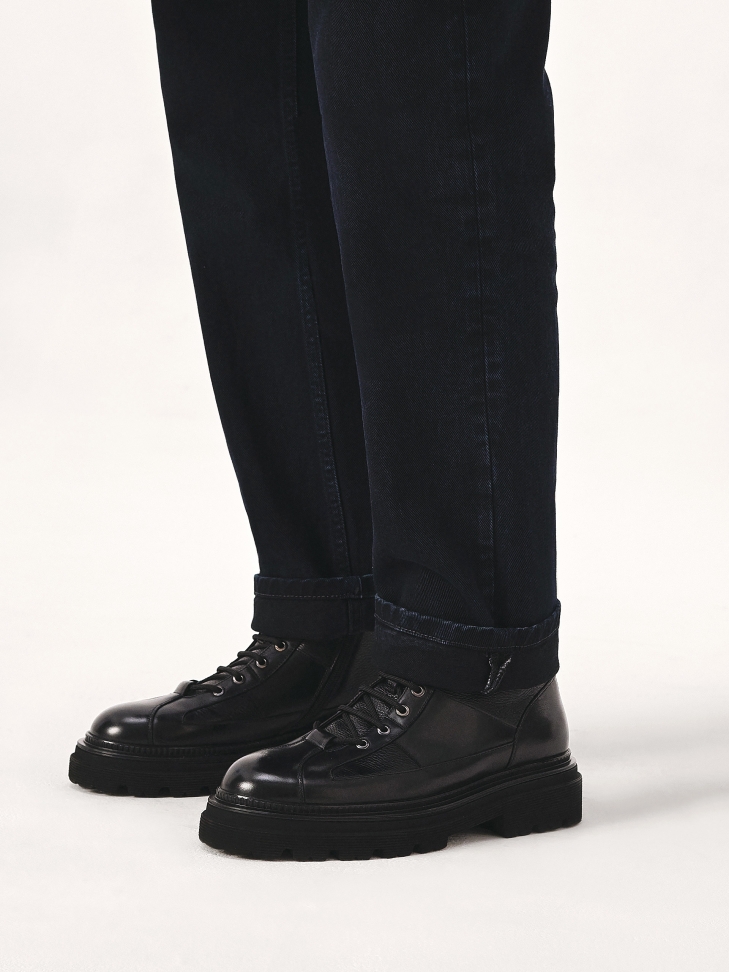 All-purpose black boots on a treaded sole