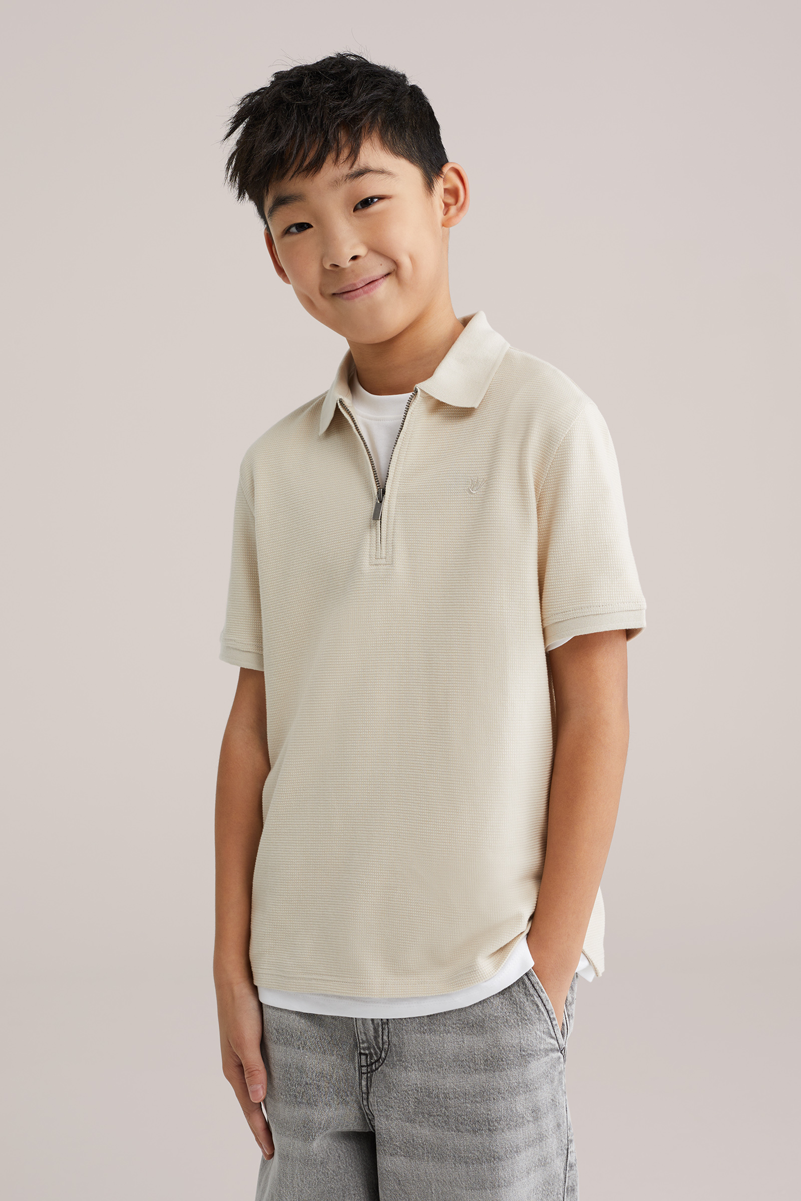 Jongens polo met quarter-zip en embroidery