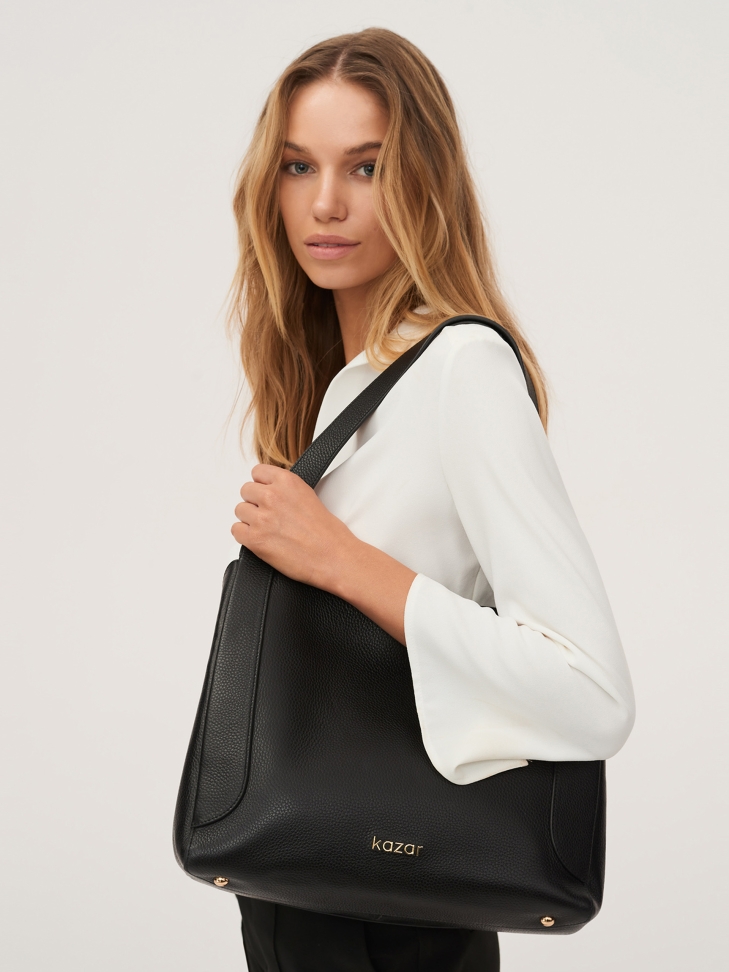 Ladies’ leather bag with a unique shape