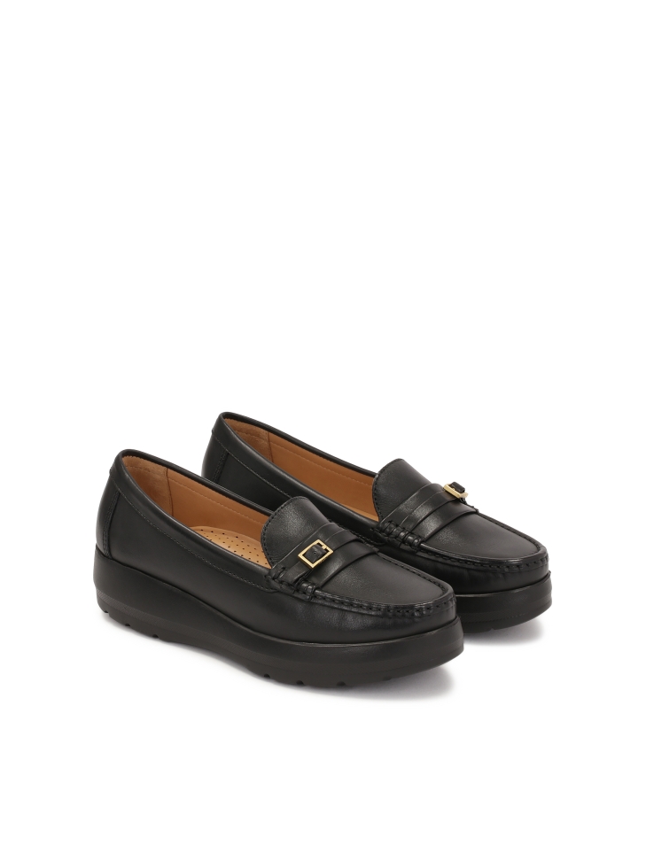 Black loafers on a raised sole