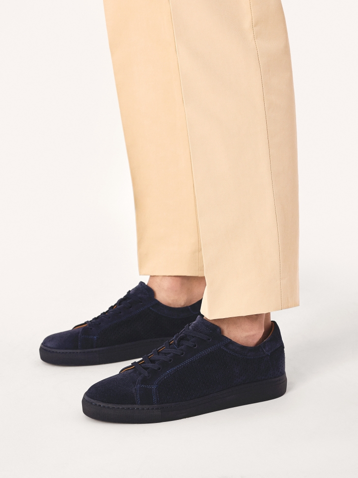 Navy blue sneakers with lace-up upper