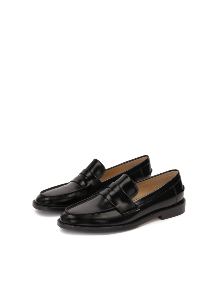 Black stylish loafers made of grain leather