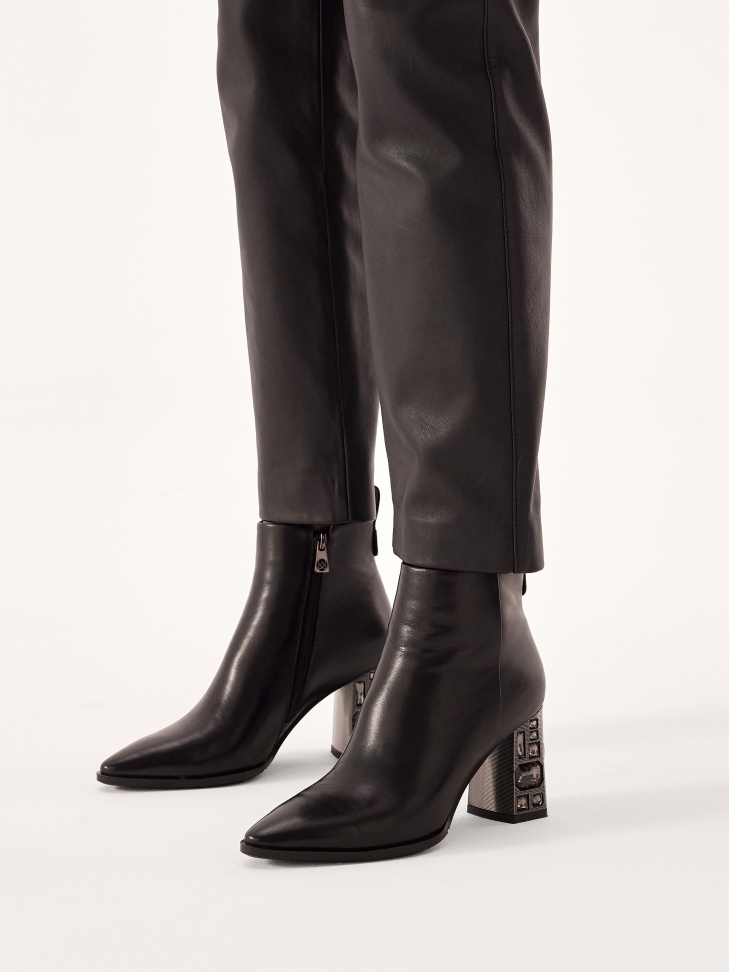 Black boots with decorative heel