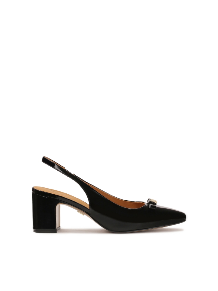 Black patent leather pumps with embellishment on the nose