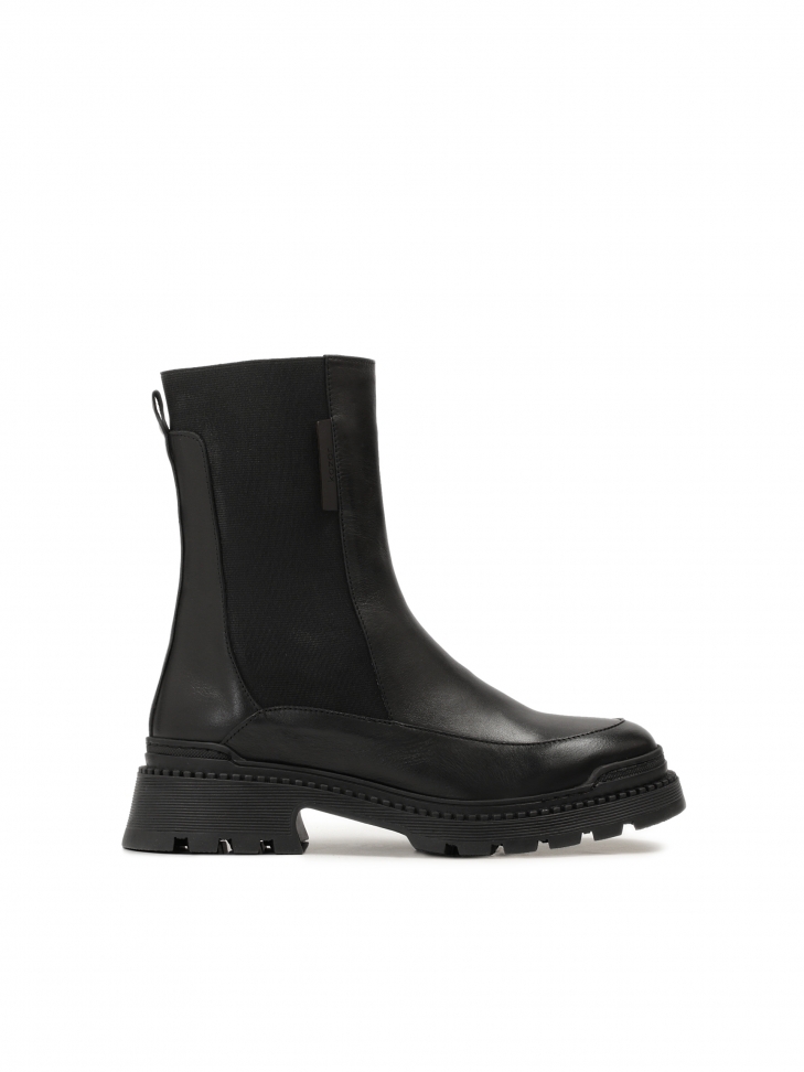 Chelsea-type leather booties on a thick, futuristic sole