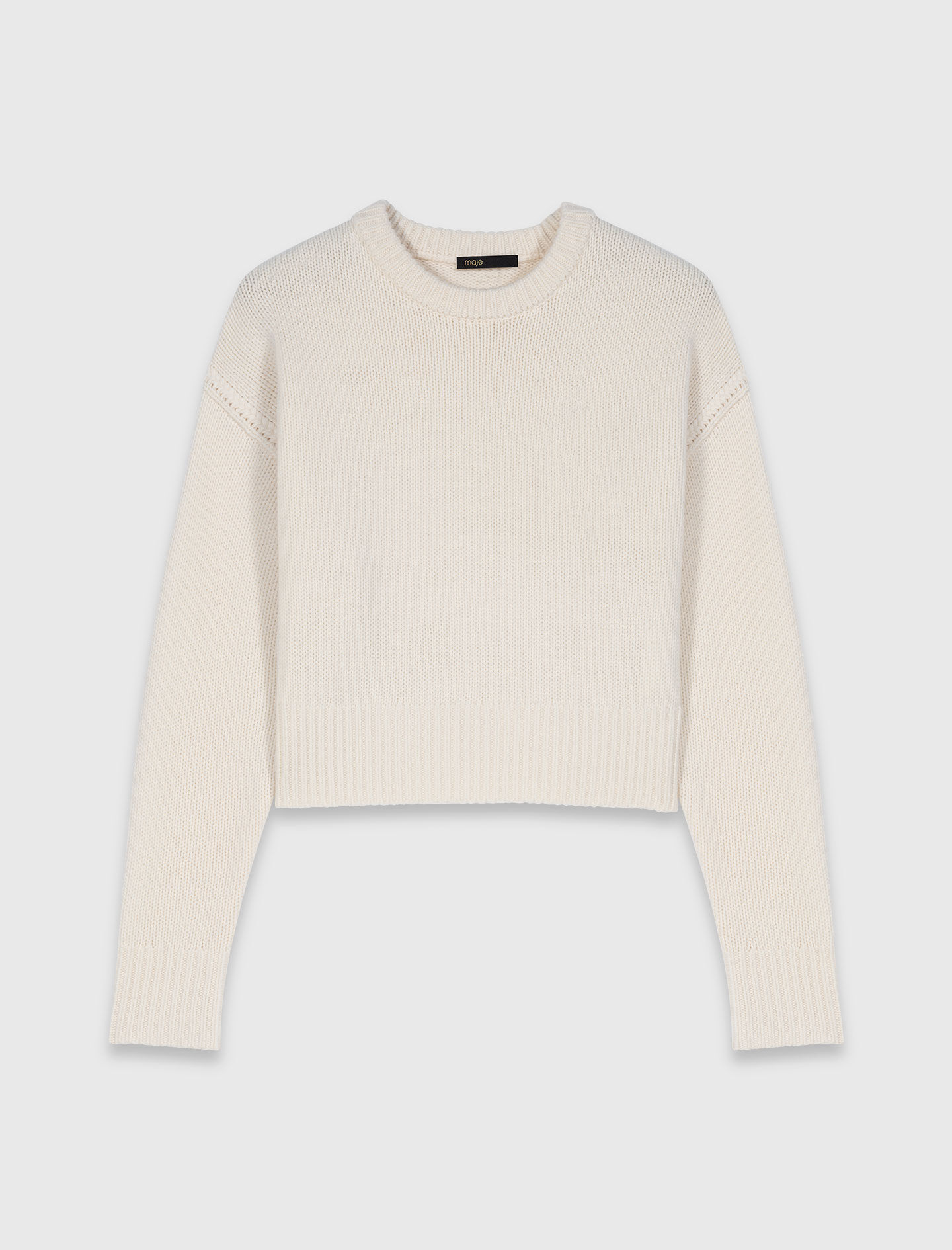 Pull avec broche florale