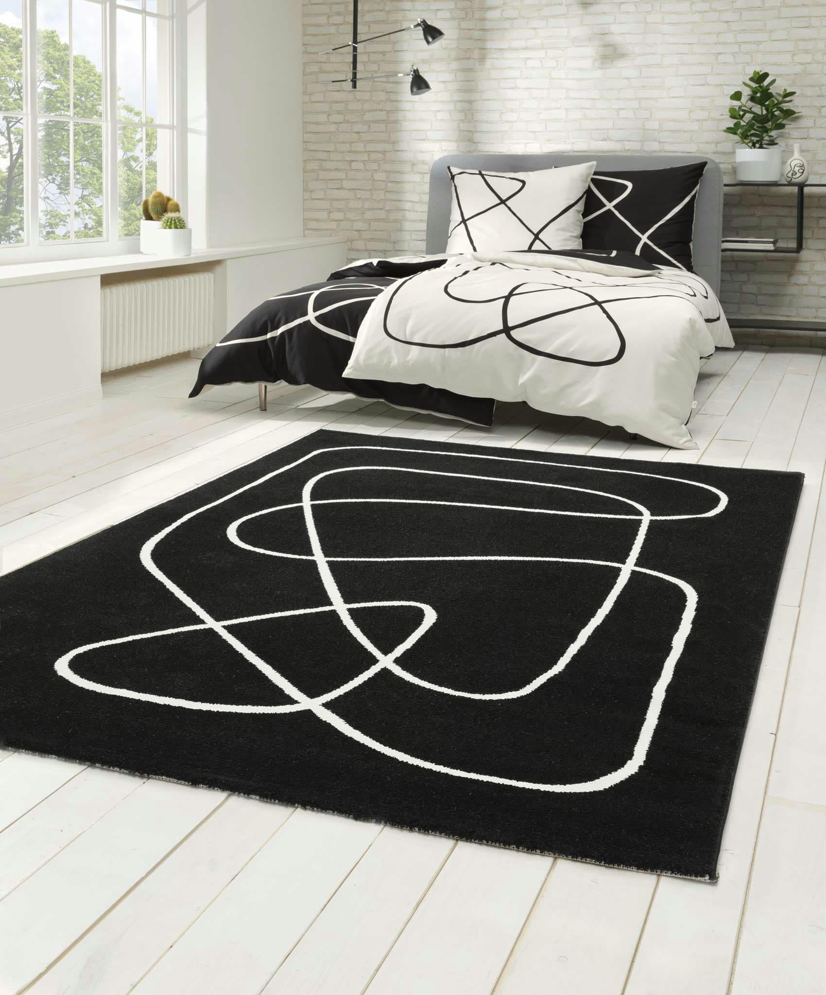 ARTIST - Tapis graphique design abstrait fond noir 133x200