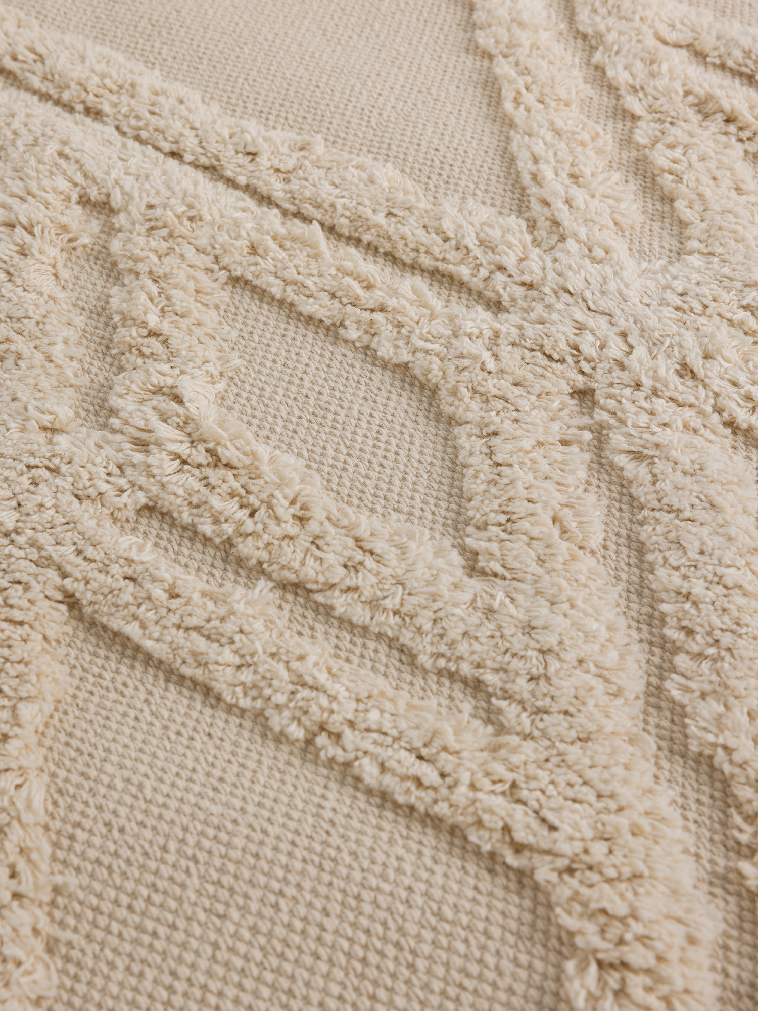 Tappeto rettangolare con motivo taftato in rilievo