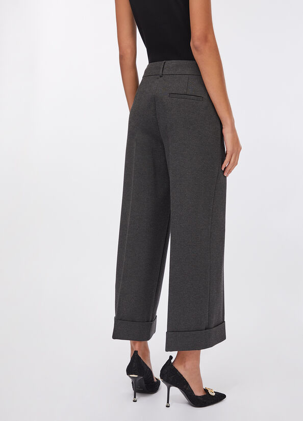 Pantaloni cropped con piega