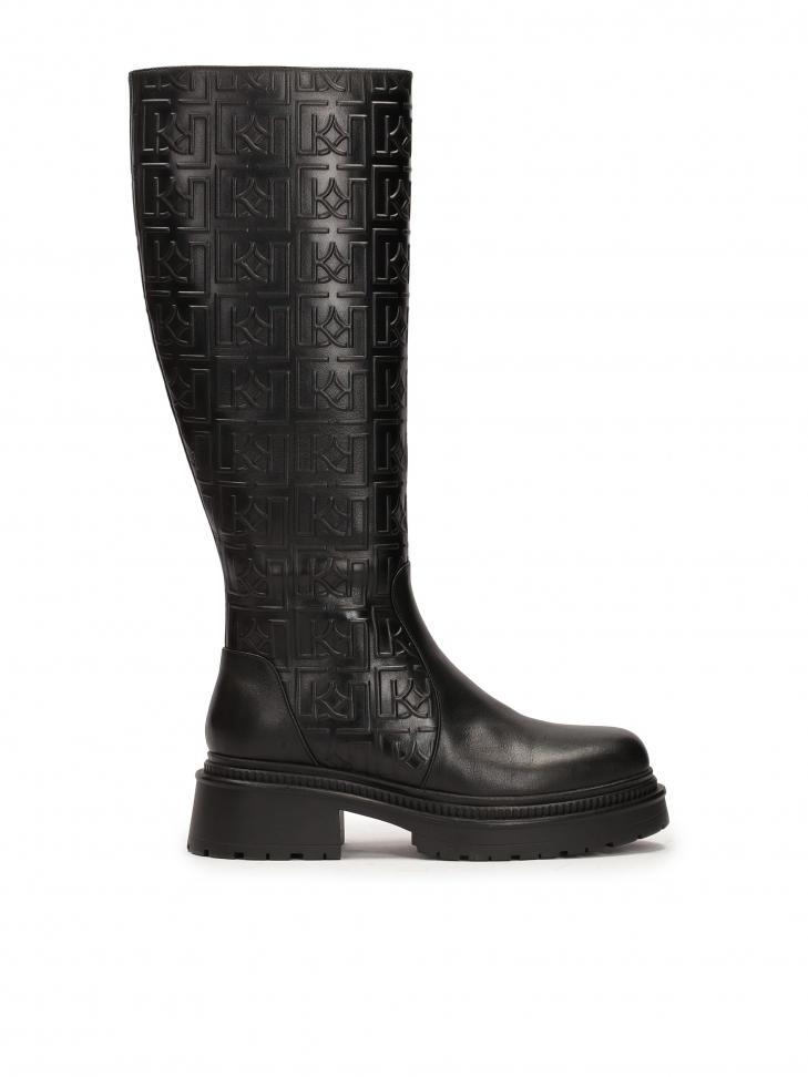 Leather boots embellished with embossed pattern
