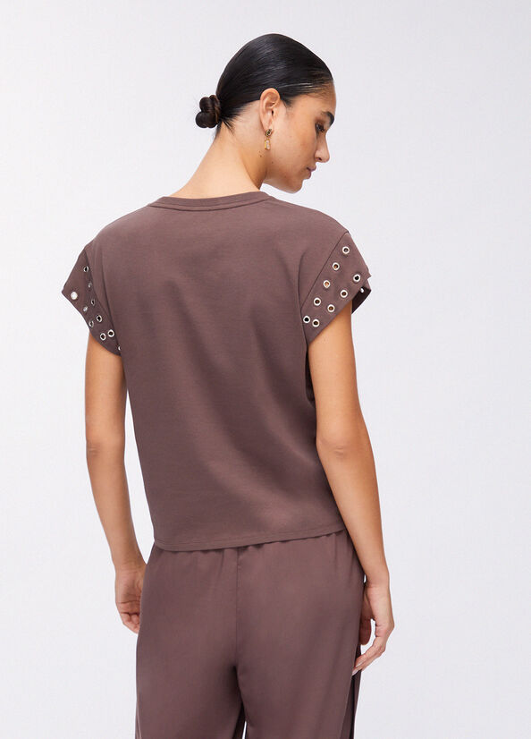 T-shirt con occhielli decorativi
