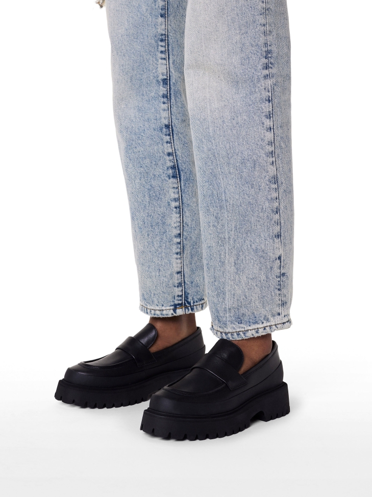 Leather shoes on a tractor sole