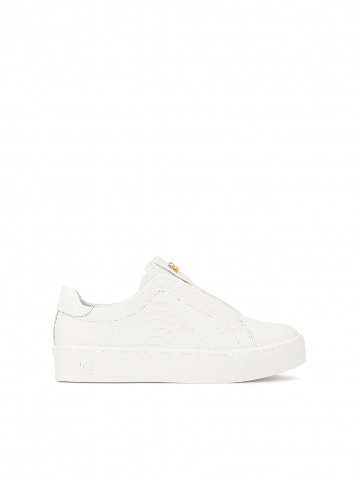 White sneakers with embossed KAZAR monograms