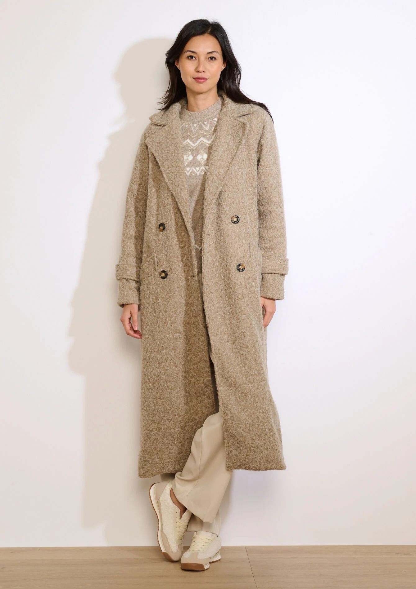 Lange jas met lusstructuur