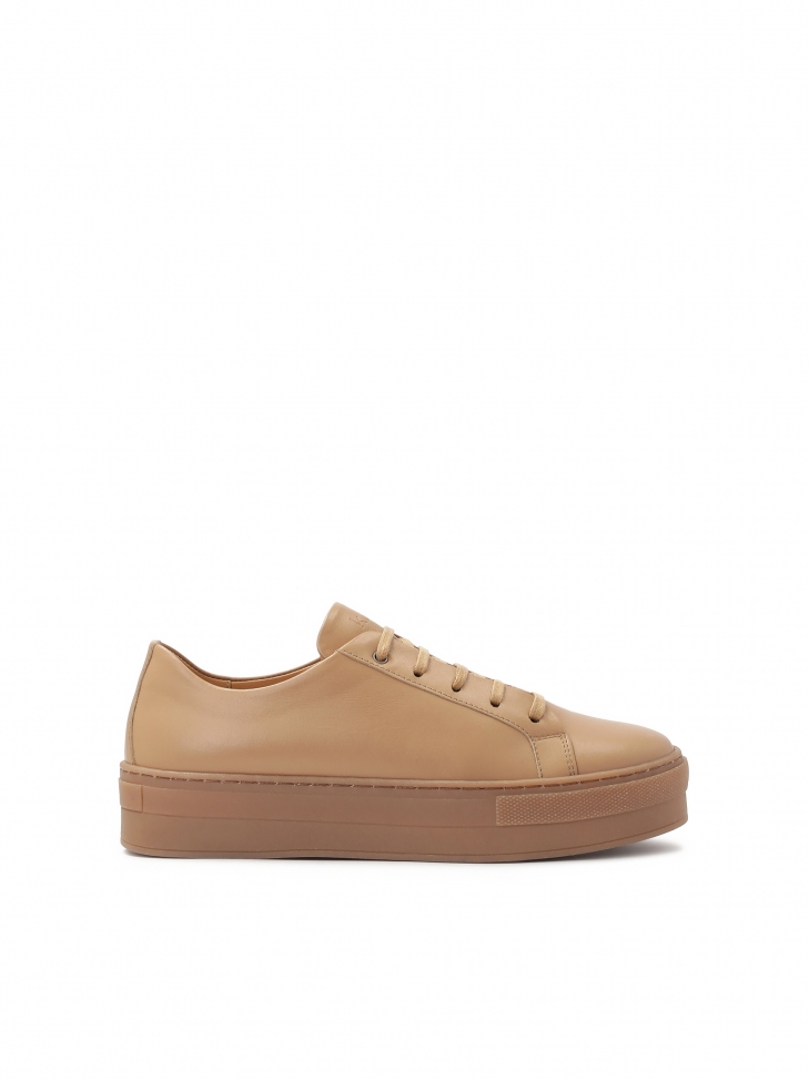 Light brown sneakers on a thick sole