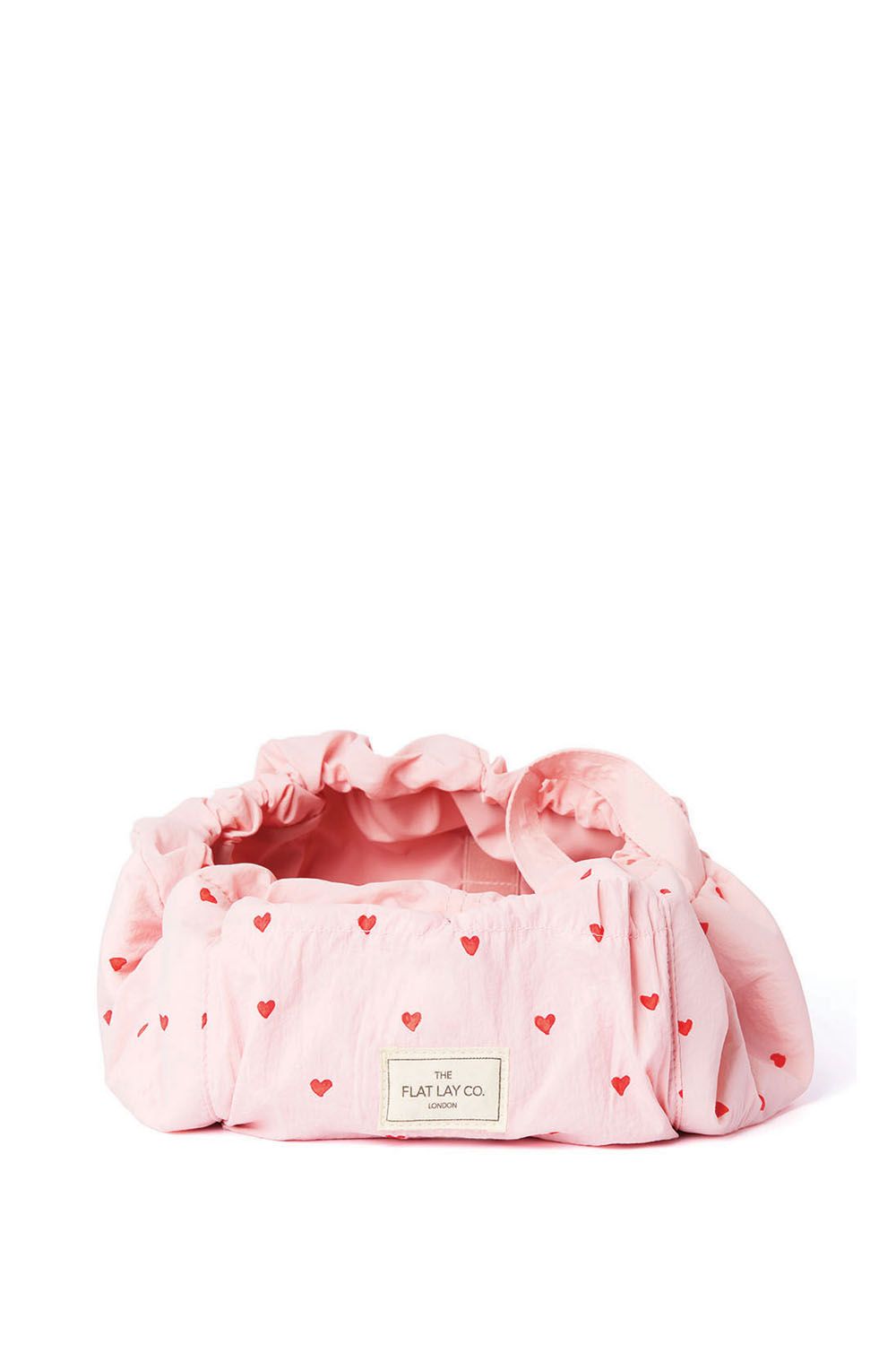 The Flat Lay Co Drawstring Makeup Bag in Sweet Pink Hearts Parachute