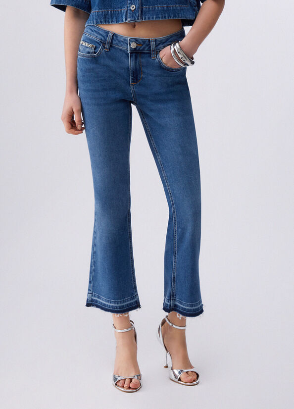 Jeans bootcut con orli unfinished
