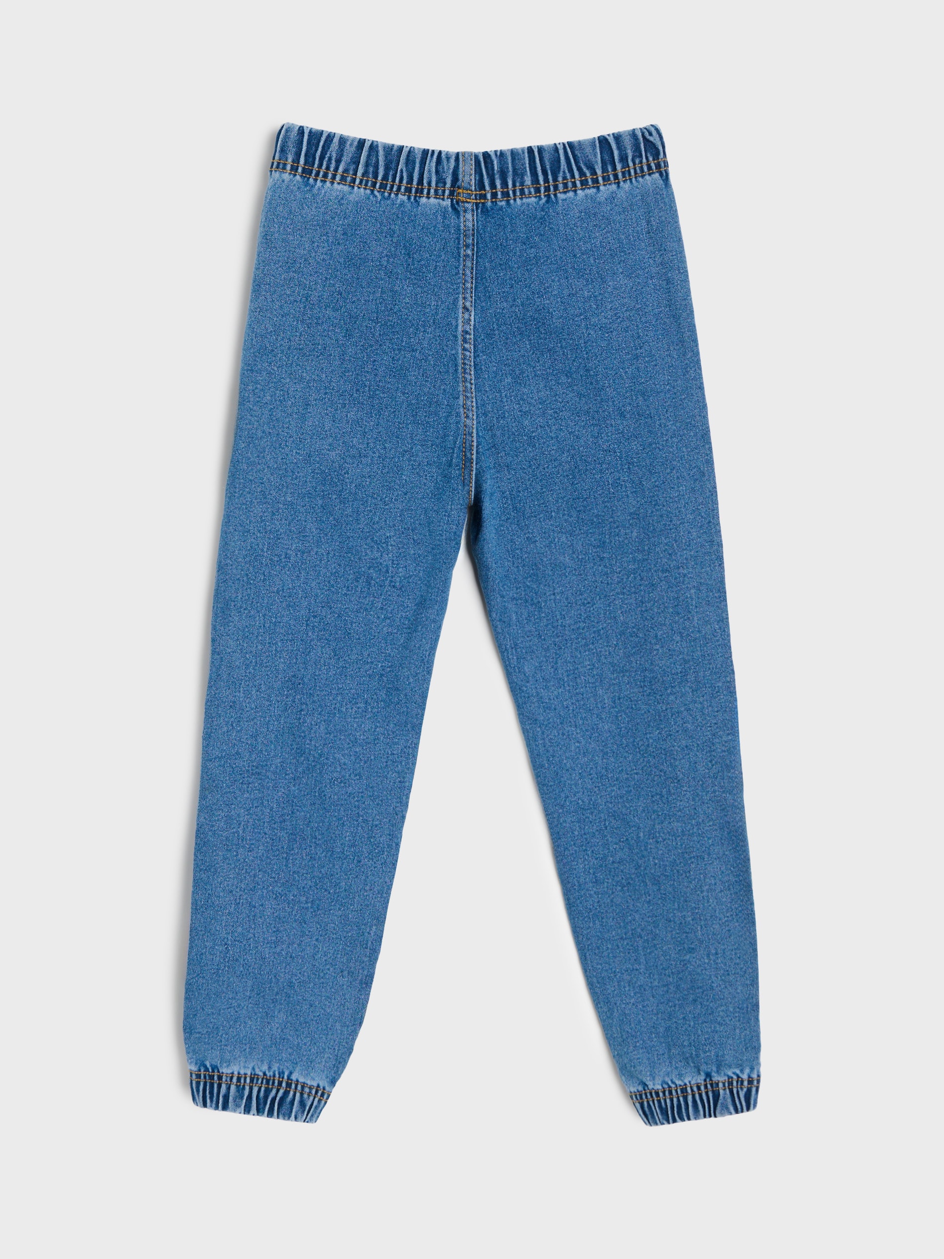 Jeansy jogger z motywem dinozaurów