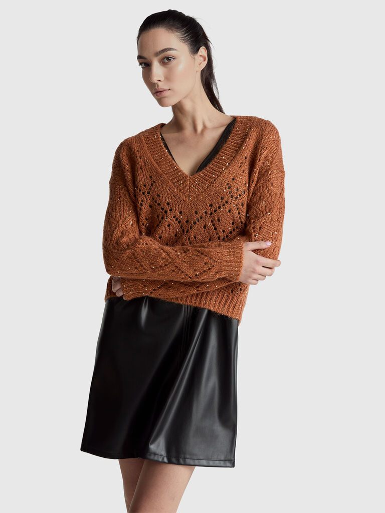 Perforated sweater with sequins