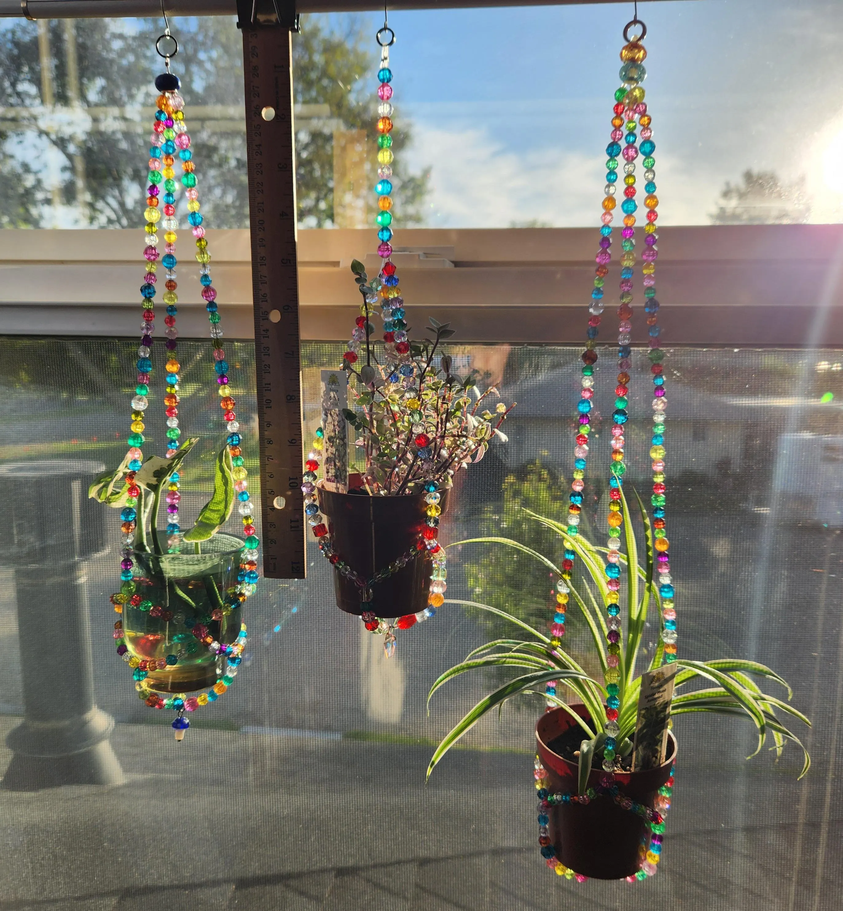 Unique handmade bead plant hangers for small pots and propagations.