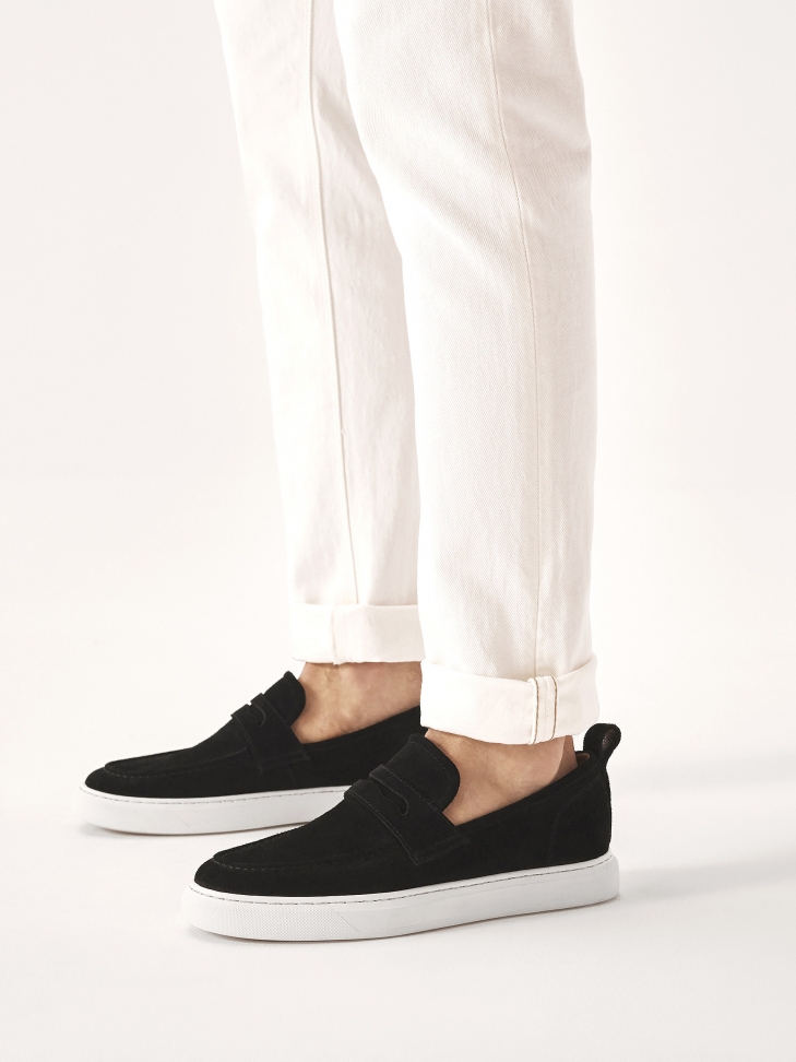 Black suede slip-on sneakers on contrasting sole