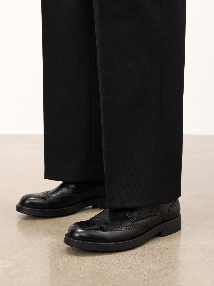 Black casual shoes with intricate embellishment