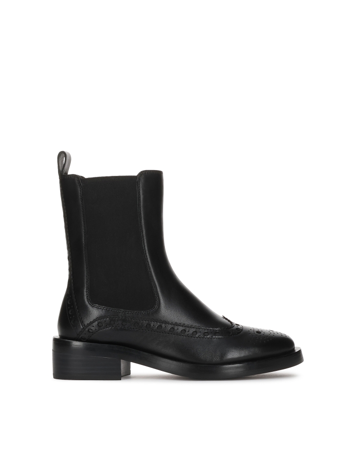Black Chelsea boots with rosette embellishment