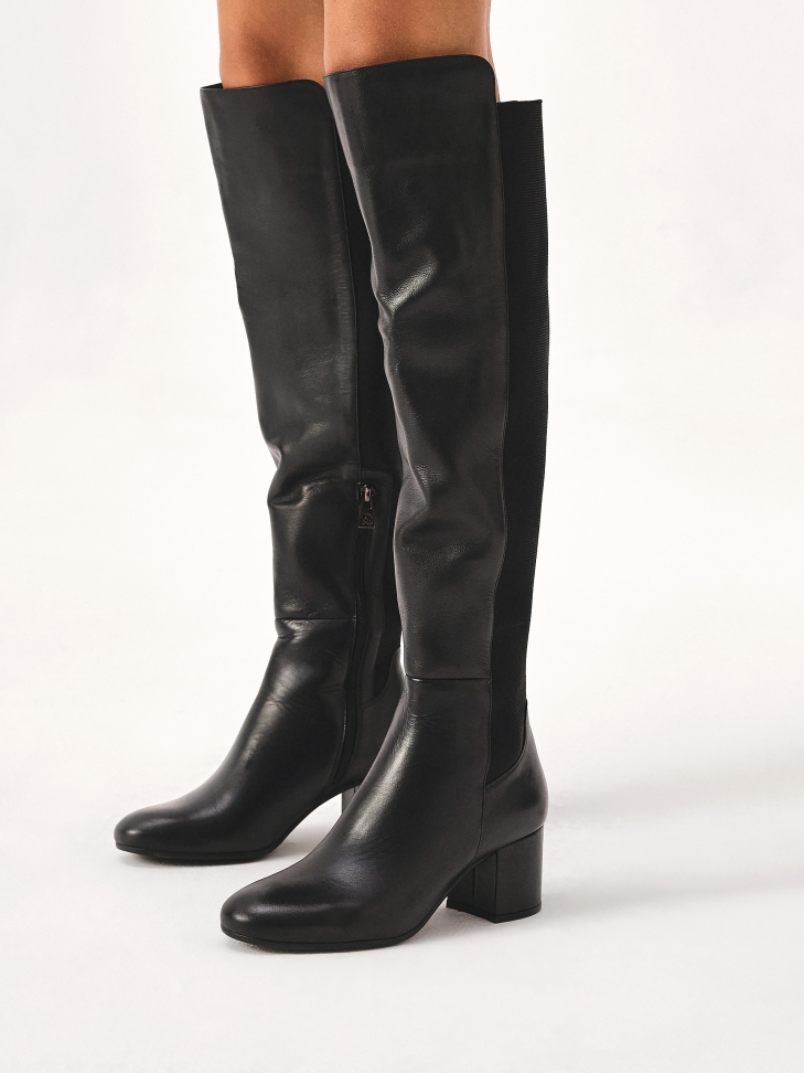 Black heeled boots with elastic inserts