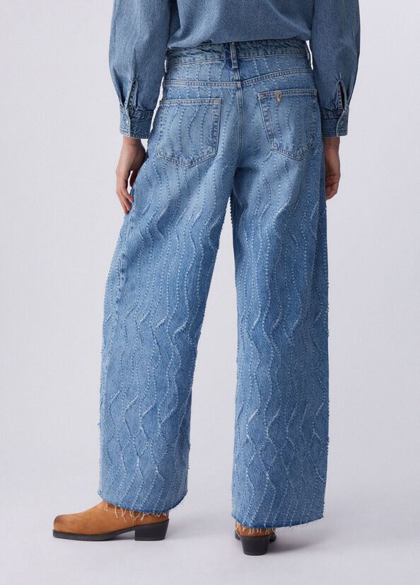 Jeans flare con dettagli laserati