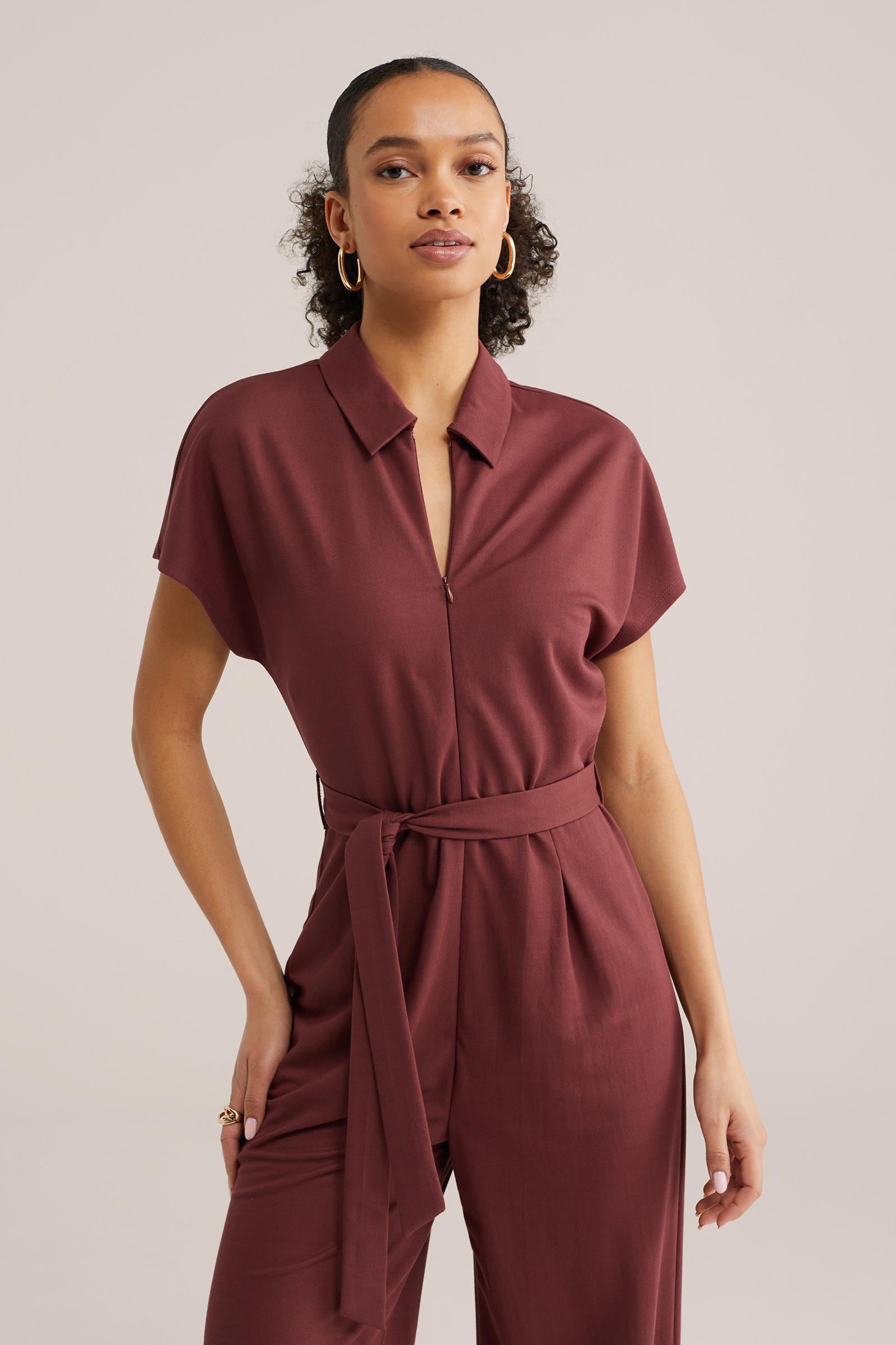 Dames jersey jumpsuit met ritskraag