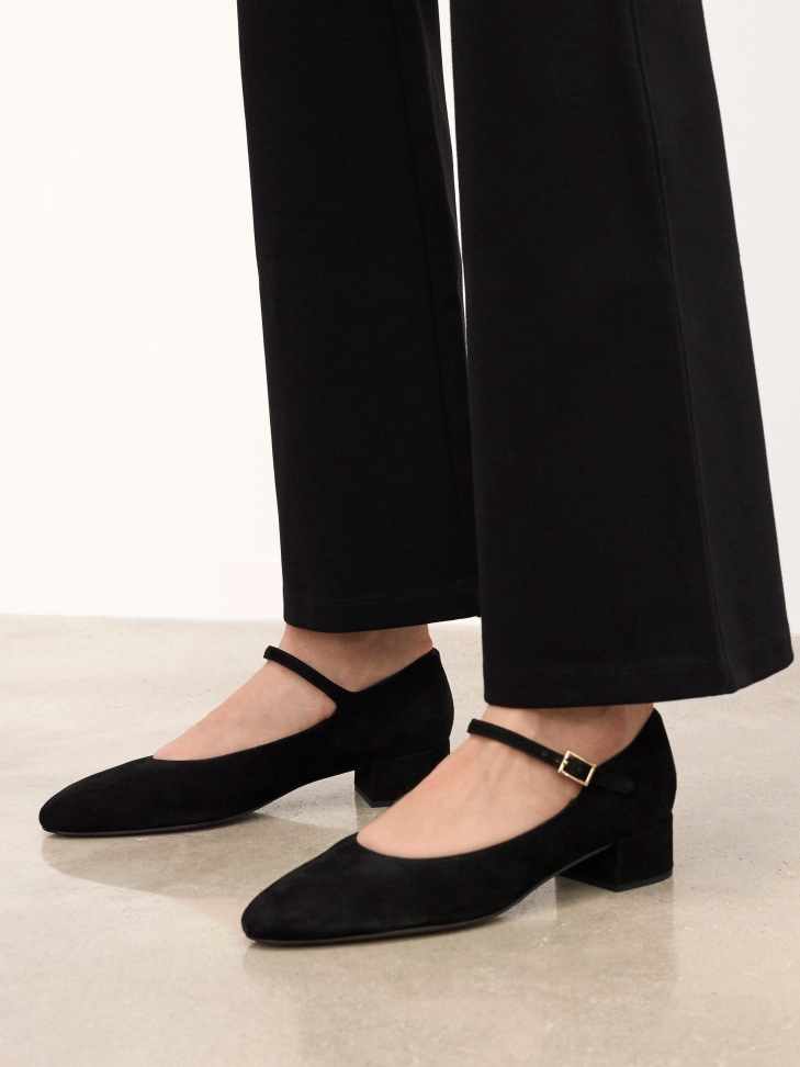 Black suede pumps with strap and low heel