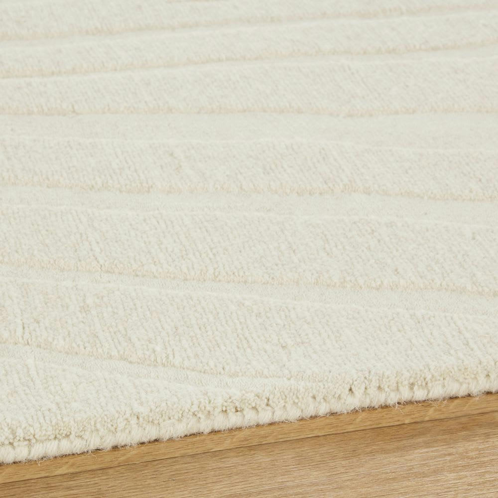 ARGENS - Tapis tufté en laine et coton recyclé motifs en relief écrus 140x200