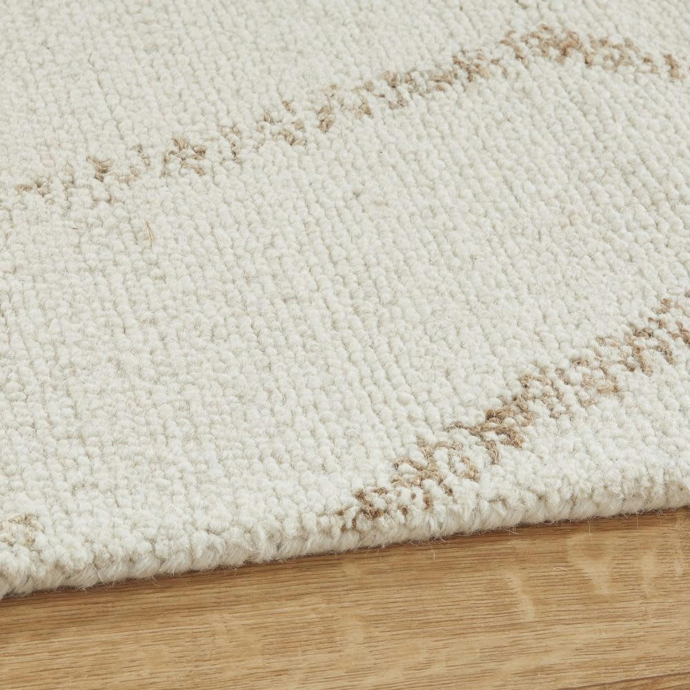 - Tapis tufté en laine, en coton et en jute blanc et beige, 140x200