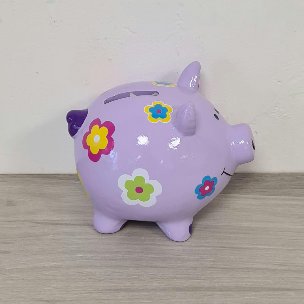 - Petite tirelire cochon violet