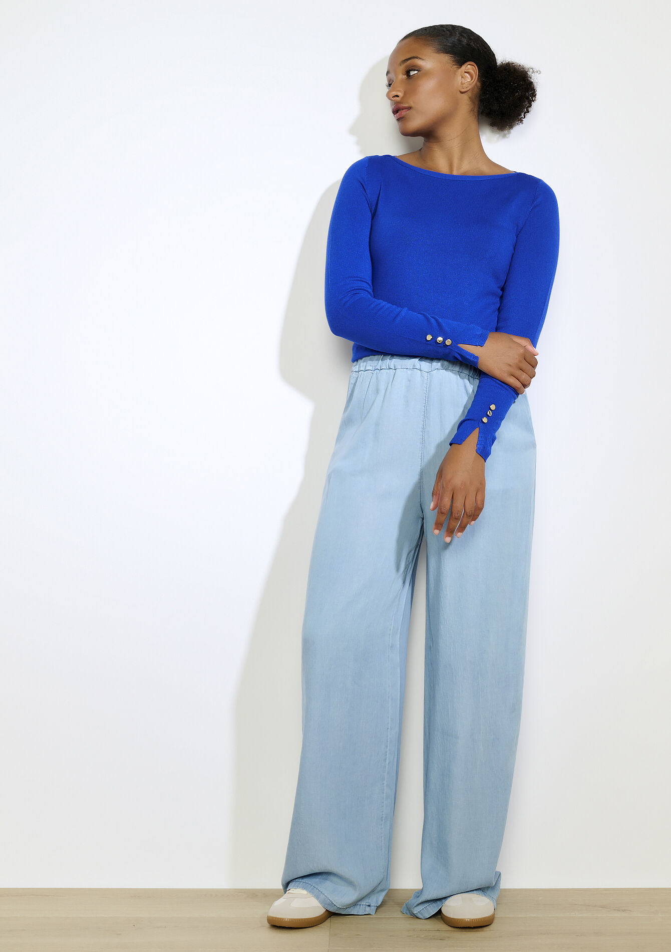 Trui met gouden knopen