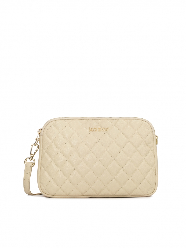 Small handbag with quilted design on leather strap