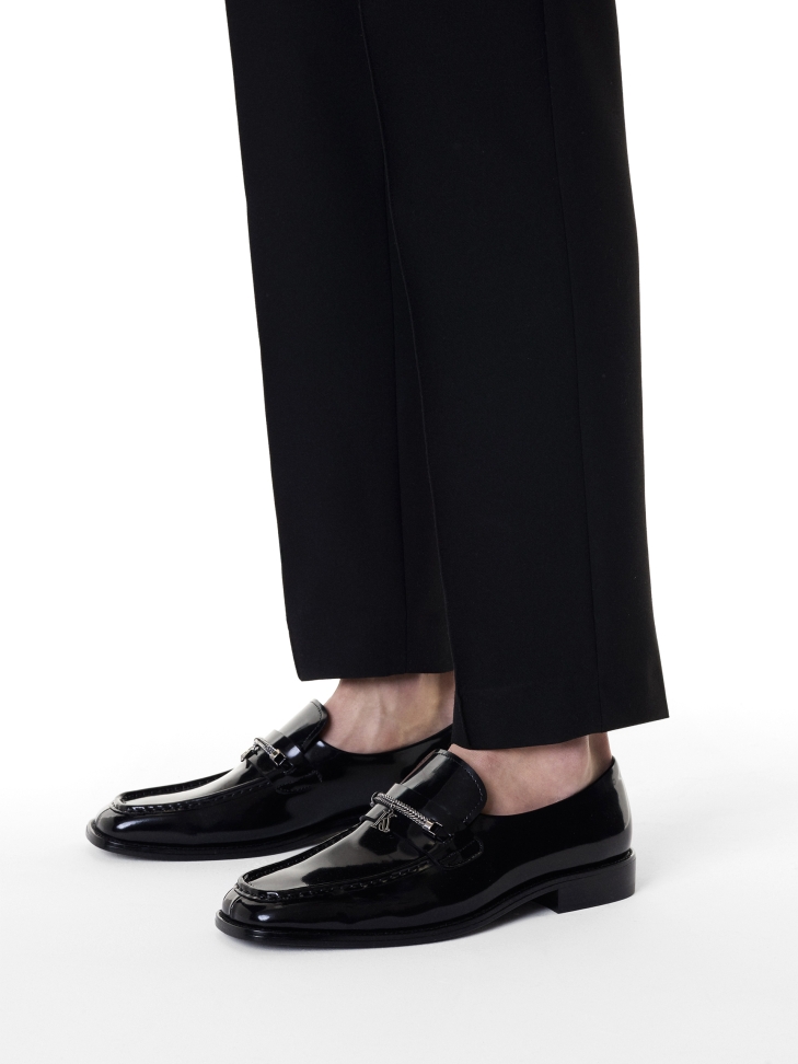 Black loafers with jewelry embellishment
