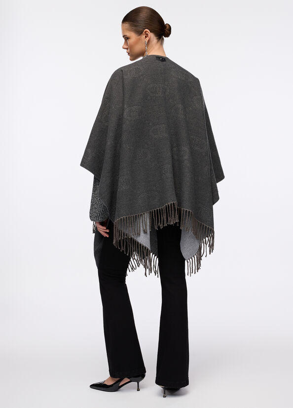 Poncho con logo e frange