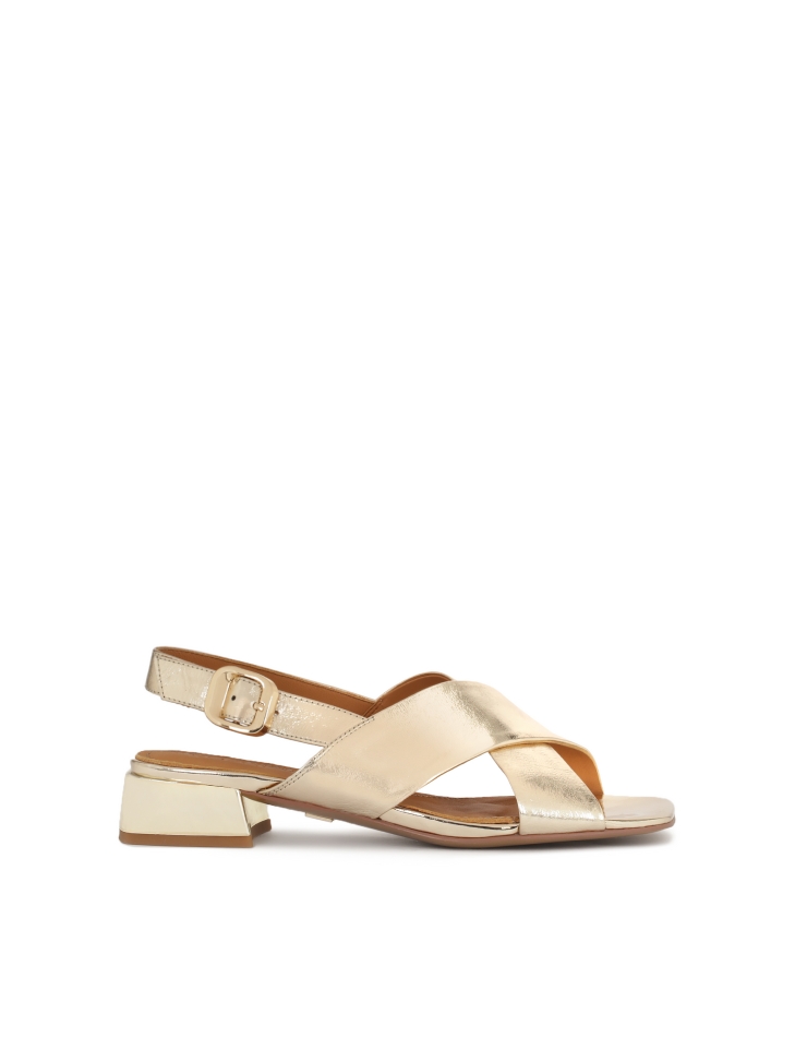 Low sandals in metalized gold leather