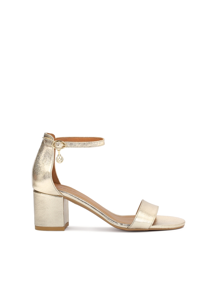 Golden leather sandals on a wide heel