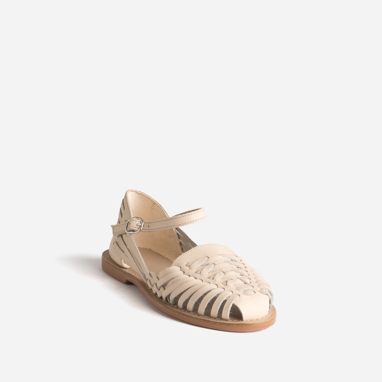 Sandale fermée écrue cuir tressé