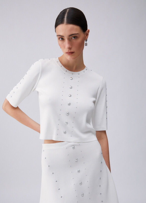 Top in maglia con borchie