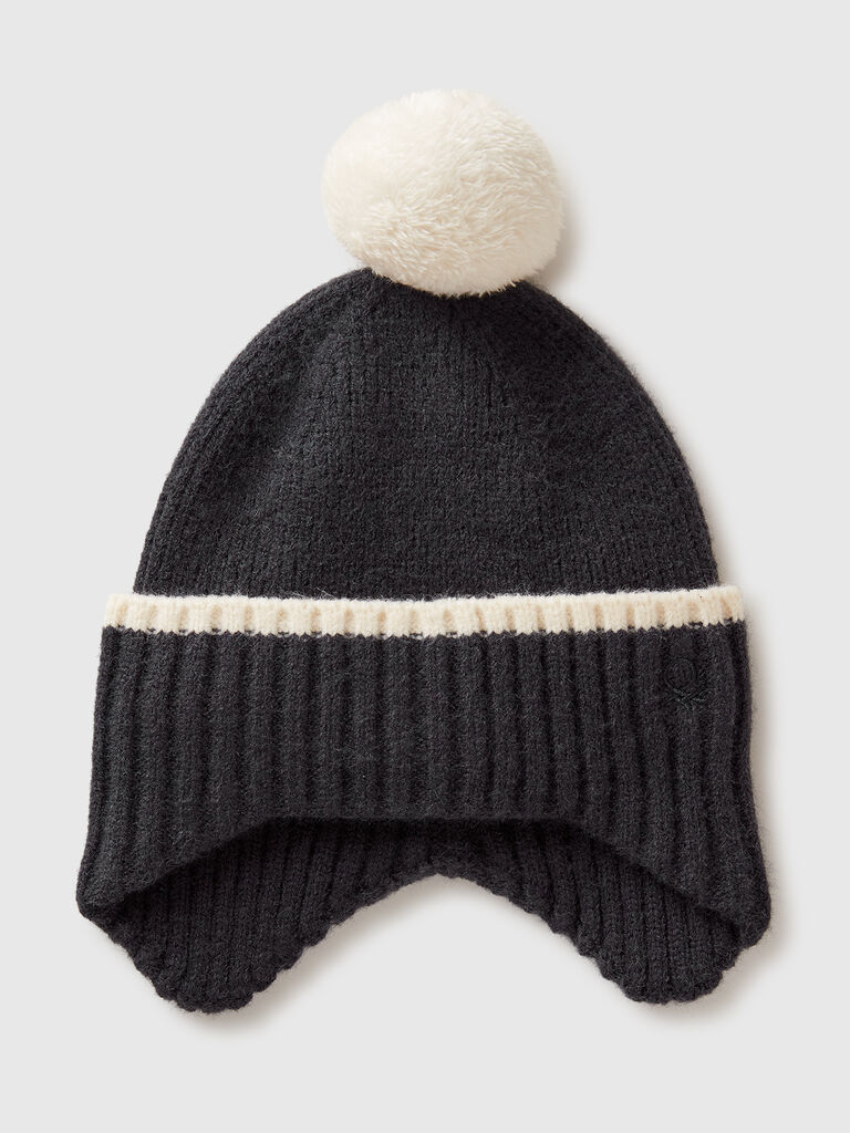 Hat with earflaps and pom pom