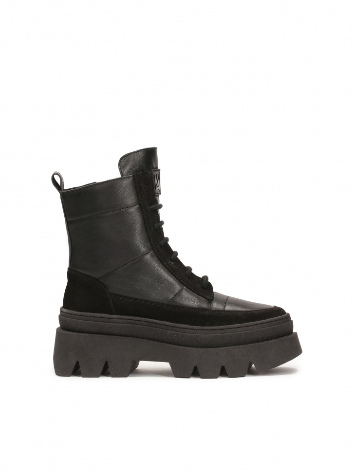 Boots made of combined materials on a thick sole