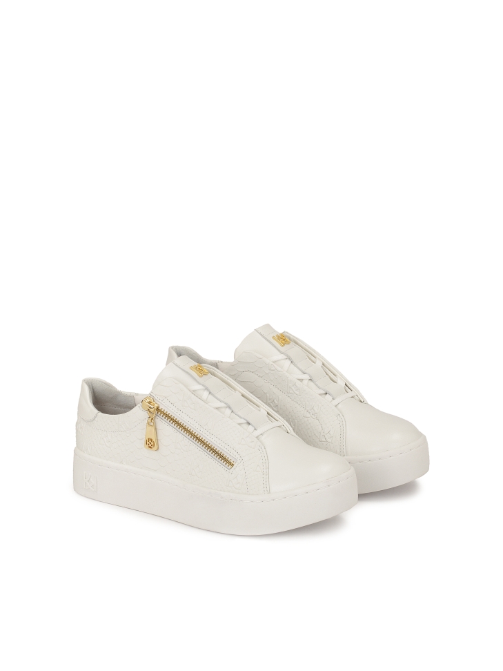 White sneakers with embossed pattern and zipper closure