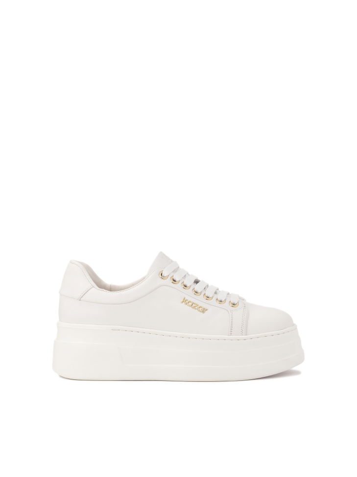 White leather sneakers on a thick sole