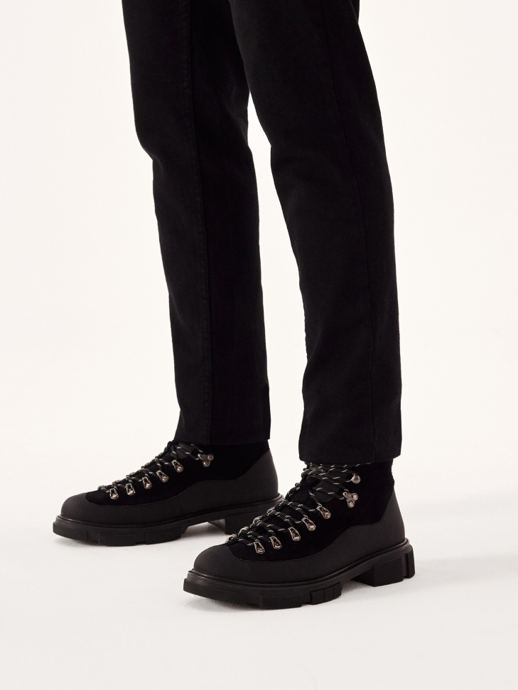 Lace-up boots reinforced with a rubber insert