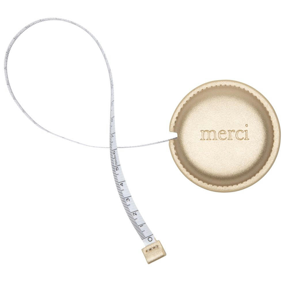 - Mètre ruban doré